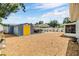 Spacious backyard with storage shed, outdoor kitchen area, and mature landscaping at 9056 108Th Ave, Seminole, FL 33777