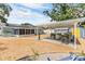Large backyard with outdoor kitchen, seating, and room for entertaining at 9056 108Th Ave, Seminole, FL 33777