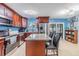 Well-appointed kitchen with a center island, stainless steel appliances, and natural light at 9056 108Th Ave, Seminole, FL 33777