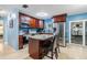 Stylish kitchen with stainless steel appliances, granite counters, and a convenient breakfast bar at 9056 108Th Ave, Seminole, FL 33777
