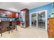 Contemporary kitchen with stainless appliances, granite counters, and access to the backyard at 9056 108Th Ave, Seminole, FL 33777