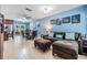 Open-concept living room with tile floors and plenty of space for entertaining at 9056 108Th Ave, Seminole, FL 33777