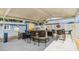 Covered outdoor kitchen includes bar seating, grill, and decorative accents at 9056 108Th Ave, Seminole, FL 33777
