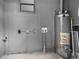 Interior view of the utility room with updated water heater at 9310 N 12Th St, Tampa, FL 33612