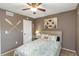 Bedroom features nautical decor, a comfortable bed with ocean-themed bedding, and a light fixture at 940 Virginia St # 303, Dunedin, FL 34698
