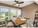 Cozy dining area with a modern ceiling fan and plenty of natural light at 940 Virginia St # 303, Dunedin, FL 34698