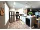 Well-equipped kitchen with stainless steel appliances, white cabinets, granite countertops, and a view into the dining area at 940 Virginia St # 303, Dunedin, FL 34698