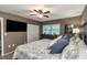 Comfortable main bedroom features a ceiling fan and dresser at 940 Virginia St # 303, Dunedin, FL 34698