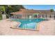 Community pool with a lifeguard station and a well-maintained pool area at 940 Virginia St # 303, Dunedin, FL 34698