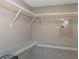 Walk-in closet with wire shelving on three walls, maximizing storage space and organization at 940 Virginia St # 303, Dunedin, FL 34698
