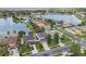 Gorgeous aerial view of this lakeside home highlighting the pool, backyard, and neighborhood at 31111 Bridgegate Dr, Wesley Chapel, FL 33545