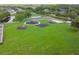 An aerial view shows a park with playground equipment, courts, and picnic areas, ideal for Gathering activities at 31111 Bridgegate Dr, Wesley Chapel, FL 33545