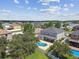 Lovely backyard with pool as seen from an aerial view of the home within a residential neighborhood at 31111 Bridgegate Dr, Wesley Chapel, FL 33545