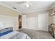Comfortable bedroom with closet, carpet flooring, and neutral colors at 31111 Bridgegate Dr, Wesley Chapel, FL 33545
