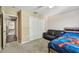 Bedroom featuring a couch, closet, bed, and connecting room at 31111 Bridgegate Dr, Wesley Chapel, FL 33545