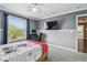This is a secondary bedroom offering gray walls, carpeted floors, and a ceiling fan at 31111 Bridgegate Dr, Wesley Chapel, FL 33545