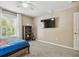 Bedroom featuring a window view and carpet flooring at 31111 Bridgegate Dr, Wesley Chapel, FL 33545
