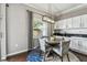 Cozy dining area featuring a modern light fixture and window, perfect for enjoying meals with a view at 31111 Bridgegate Dr, Wesley Chapel, FL 33545