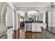Kitchen featuring granite countertops, stainless steel appliances, and seamless flow to living area at 31111 Bridgegate Dr, Wesley Chapel, FL 33545