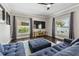Bright living room with hardwood floors, recessed lights, and large windows with views of the lake at 31111 Bridgegate Dr, Wesley Chapel, FL 33545