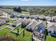 Aerial view showing community, homes with spacious backyards and scenic surroundings at 10024 Merry Fawn Ct, Sun City Center, FL 33573
