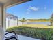 Back patio view overlooking a serene pond and lush greenery, creating a tranquil retreat at 10024 Merry Fawn Ct, Sun City Center, FL 33573