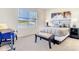 Serene bedroom with lake view, plush bed, and neutral decor at 10024 Merry Fawn Ct, Sun City Center, FL 33573