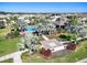 Community pool area showcases lush landscaping, playground, and inviting relaxation spaces at 10024 Merry Fawn Ct, Sun City Center, FL 33573
