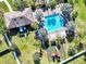 Aerial view of pool and recreational area with comfortable seating and playground for residents at 10024 Merry Fawn Ct, Sun City Center, FL 33573