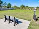 Community dog park featuring a bench and waste station for residents and their furry friends at 10024 Merry Fawn Ct, Sun City Center, FL 33573