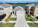 Charming single-Gathering home featuring a two-car garage and a view of the tranquil lake at 10024 Merry Fawn Ct, Sun City Center, FL 33573