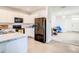 Open-concept kitchen featuring white cabinetry, stainless steel appliances, and adjacent living area at 10024 Merry Fawn Ct, Sun City Center, FL 33573