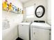 Well-equipped laundry room with modern washer and dryer and ample storage space at 10024 Merry Fawn Ct, Sun City Center, FL 33573