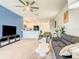 Spacious living room with eat-in kitchen, modern furniture, and lots of natural light at 10024 Merry Fawn Ct, Sun City Center, FL 33573