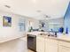 Open-concept living area featuring a scenic view, and a glimpse of the kitchen at 10024 Merry Fawn Ct, Sun City Center, FL 33573