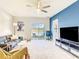 Inviting living room with comfortable seating, modern decor, and a scenic lake view at 10024 Merry Fawn Ct, Sun City Center, FL 33573