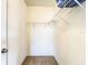 Empty walk-in closet with carpeted floor, wire shelving and lighting at 10024 Merry Fawn Ct, Sun City Center, FL 33573