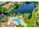 Beautiful aerial view of the community pool, waterway, and lush landscaping at 10265 Gandy N Blvd # 1409, St Petersburg, FL 33702