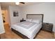 Spacious bedroom has matching nightstands and artwork, offering a serene retreat at 10265 Gandy N Blvd # 1409, St Petersburg, FL 33702