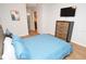 Bedroom featuring a queen bed and wooden dresser, with ensuite bathroom access at 10265 Gandy N Blvd # 1409, St Petersburg, FL 33702