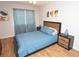 Bedroom featuring a queen size bed, wood floor, and modern decor at 10265 Gandy N Blvd # 1409, St Petersburg, FL 33702