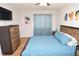 Bedroom featuring a queen bed, wood floors, and a ceiling fan at 10265 Gandy N Blvd # 1409, St Petersburg, FL 33702