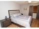 Comfortable bedroom with ceiling fan, light gray walls, and neutral-toned bedding at 10265 Gandy N Blvd # 1409, St Petersburg, FL 33702