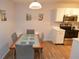 Bright dining area featuring modern frosted glass table and seating for four at 10265 Gandy N Blvd # 1409, St Petersburg, FL 33702