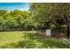 Community dog park surrounded by green trees and chain link fence. Includes signage and waste management at 10265 Gandy N Blvd # 1409, St Petersburg, FL 33702