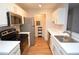 Well-lit kitchen with stainless steel appliances and white cabinets at 10265 Gandy N Blvd # 1409, St Petersburg, FL 33702