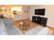 Cozy living room featuring a gray sectional sofa and open floor plan at 10265 Gandy N Blvd # 1409, St Petersburg, FL 33702
