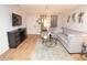 Comfortable living room featuring a gray sectional sofa, an area rug and natural light at 10265 Gandy N Blvd # 1409, St Petersburg, FL 33702