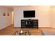 Bright living room features wood floors, modern entertainment center, and sleek design at 10265 Gandy N Blvd # 1409, St Petersburg, FL 33702