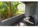 Relaxing patio with privacy fence, lush tropical landscaping, and outdoor seating at 10265 Gandy N Blvd # 1409, St Petersburg, FL 33702